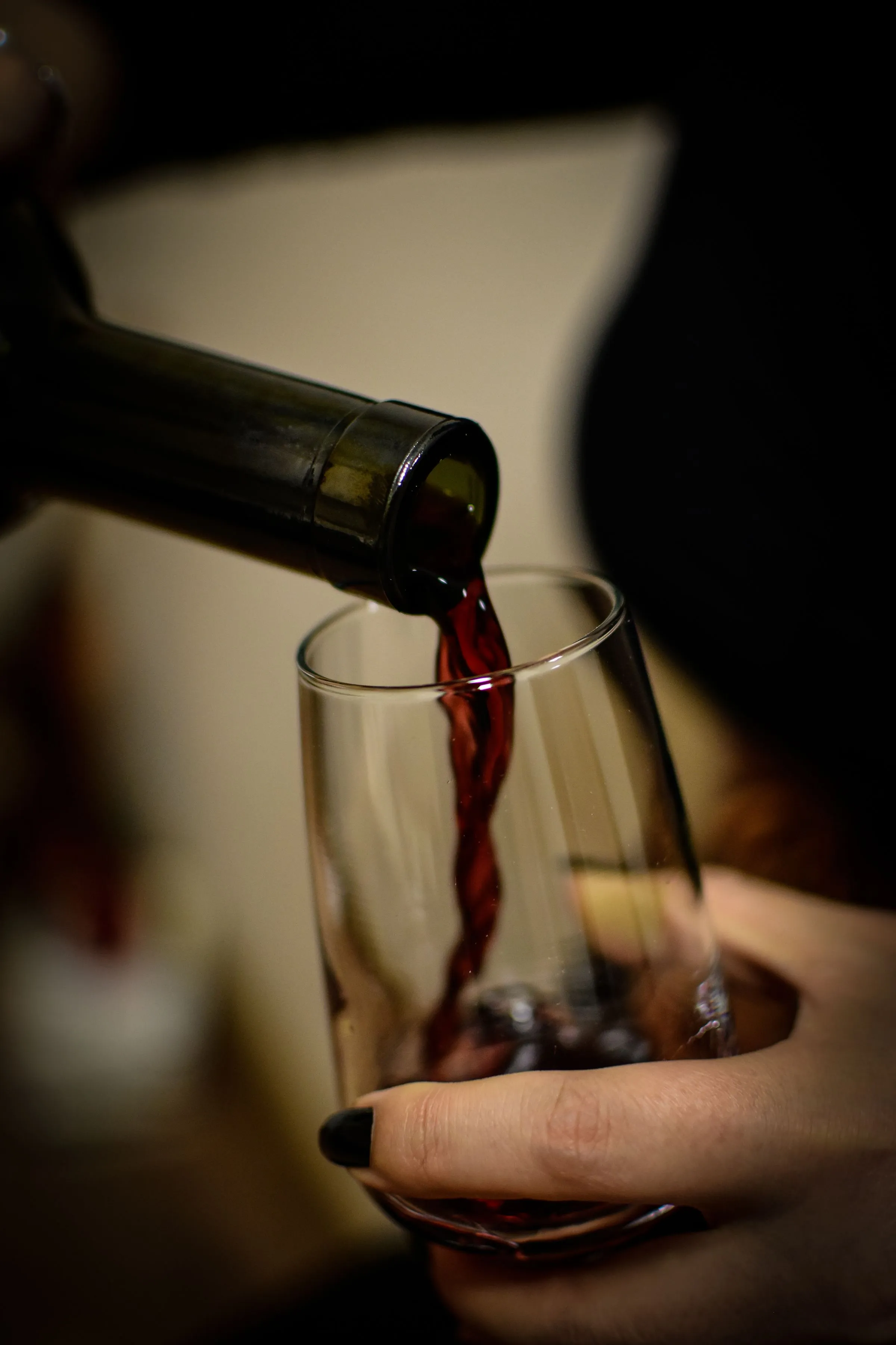 Red wine being poured into a glass